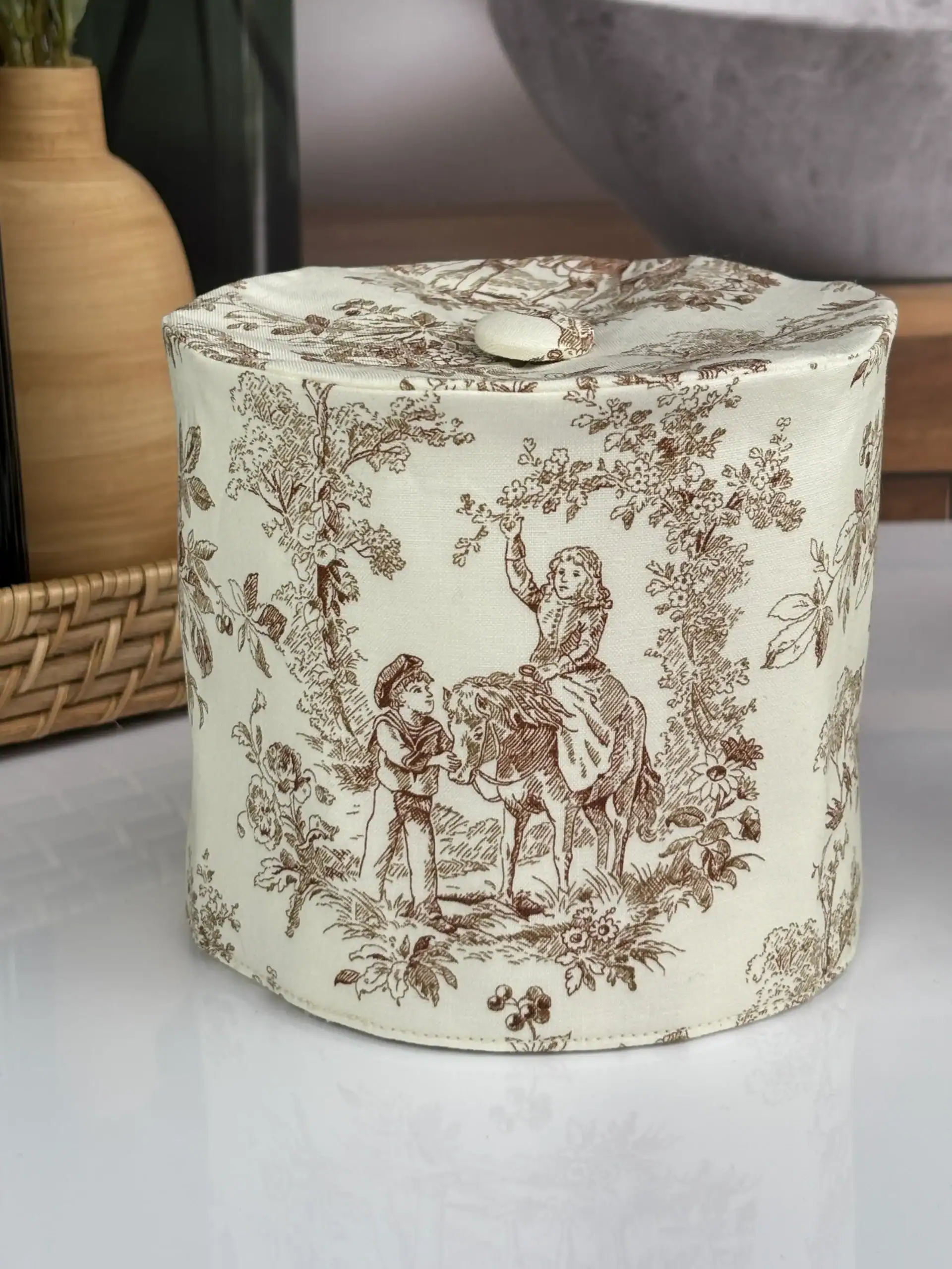Sage green toile toilet paper cover with roll inside showing perfect fit handmade bathroom accessory