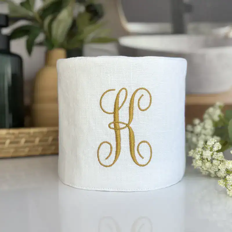 White monogram linen toilet paper cover front view handmade fabric bathroom decor by Christy Crafted Covers