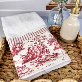 Red toile decorative hand towel with stripe trim on white terry cloth for French country bathroom