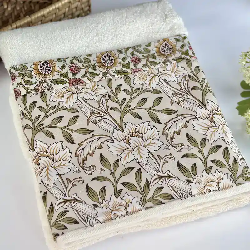 Vintage floral decorative hand towel rolled to show the green leaf and red berry botanical print, handmade in Ohio