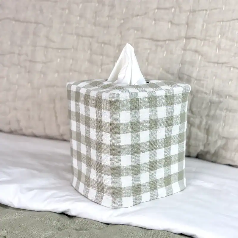 Sage green gingham tissue box cover side 1, white and sage check linen on white bedding